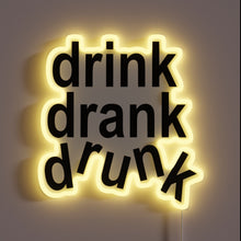 Load image into Gallery viewer, Customizable bar decor with colorful &#39;Drink&#39; phrase in bold neon.