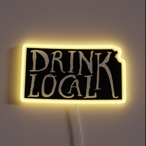 Backlit outline of Kansas map highlights local craft beer culture.