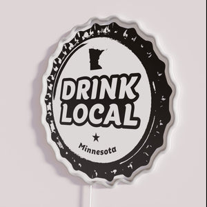 Neon craft beer bottle cap display for local Minnesota enthusiasts.