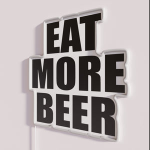 Colorful, LED-lit 'Eat More Beer' bar decor with vibrant signs.