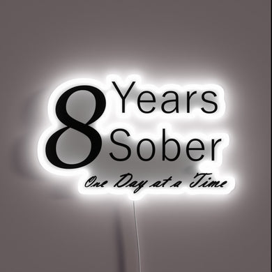 Neon anniversary sign celebrating one year of sobriety milestones daily.