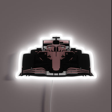 Vibrant Pink Neon Sign Featuring an F1 Car Silhouette Design