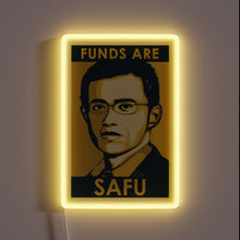 Load image into Gallery viewer, Alt text: “Neon sign featuring a stylized portrait of a man with glasses and the phrase ‘Funds Are SAFU’ glowing in yellow.”
