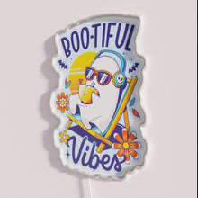 Load image into Gallery viewer, Add spooky ambiance with our glowing ghostly summer vibes sign.