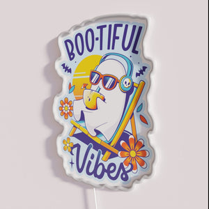 Add spooky ambiance with our glowing ghostly summer vibes sign.