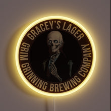 Load image into Gallery viewer, Gracey’s Lager Grim Grinning Brewing Company neon sign featuring a skeleton in a suit on a dark circular background