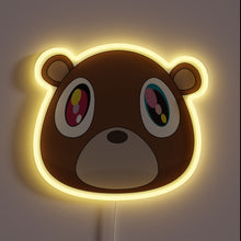 Load image into Gallery viewer, Neon sign of Kanye West’s Graduation bear head with glowing yellow outline.