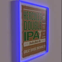 Load image into Gallery viewer, Eye-catching RGB neon sign featuring the Great Divide Hercules logo prominently.