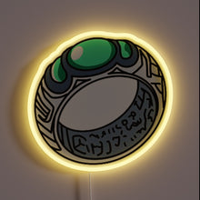 Load image into Gallery viewer, Alt text: &quot;Neon sign depicting a detailed cartoon-style ring with green gemstones and engraved markings, glowing with a yellow outline.&quot;
