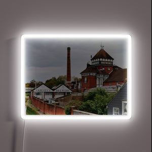Harveys Brewery in Lewes historic landmark RGB neon sign illuminates.