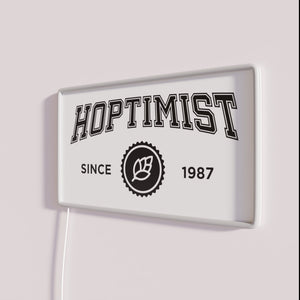 Vibrant neon bar sign with nostalgic HOPTIMIST design inspiration