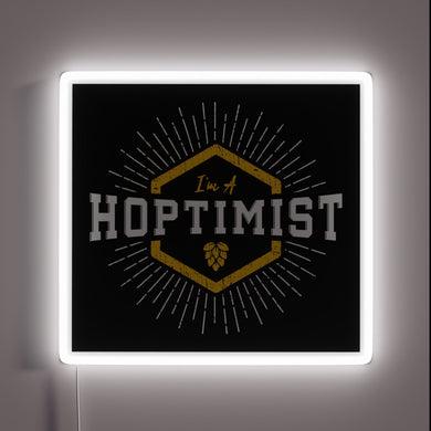 Vibrant neon sign with starburst design, spreading positivity and joy.