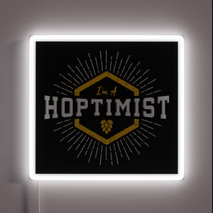 Vibrant neon sign with starburst design, spreading positivity and joy.