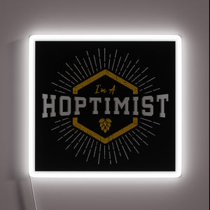 Brighten up your space with this HOPTIMIST neon color sign