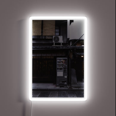 Vintage-style neon advertisement for unique Japanese beer vending machine experience.