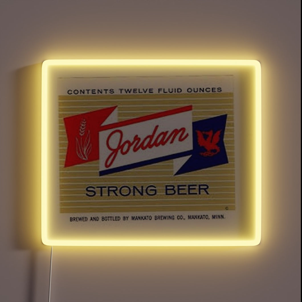 Neon sports-themed beer sign featuring Jordan Strong logo in RGB.