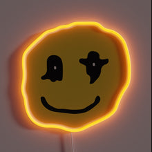 Load image into Gallery viewer, Wavy yellow neon smiley face with abstract black eyes.
