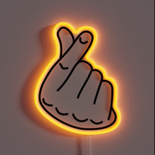 Load image into Gallery viewer, Neon sign of a hand making the Korean finger heart gesture with an orange glow.
