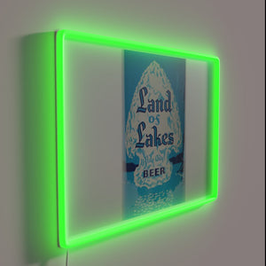 Vibrant LED sign proudly displays brand logo in modern style.