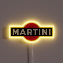Load image into Gallery viewer, Neon sign of the MARTINI logo with bold white text on a black rectangle over a red circle, glowing with a yellow outline.
