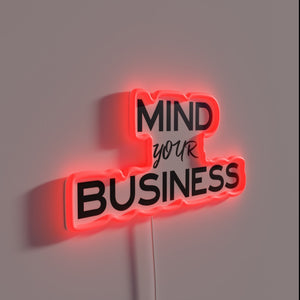 Inspiring sober living with bright vibrant "Mind Your Business" neon signage.
