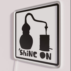 Add radiant neon ambiance with vintage-style Moonshine Alembic Shine On sign.