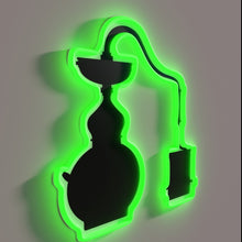 Load image into Gallery viewer, Moody, vintage-style moonshine still illuminated with colorful RBG neon lights.