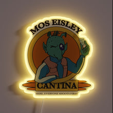 Load image into Gallery viewer, Illustration of a green alien holding a drink with the text &quot;Mos Eisley Cantina – Here, Everyone Shoots First&quot; illuminated in yellow neon.
