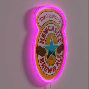 Authentic Newcastle Brown Ale logo in vibrant RGB neon lighting.