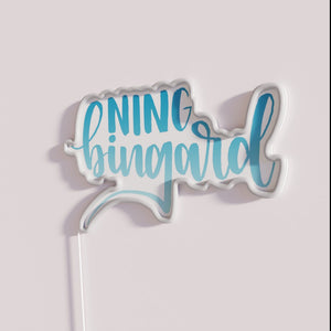 Vibrant blue gradient neon sign with Ning Bings' modern art style