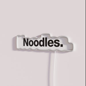 Vibrant glowing noodle sign in colorful RGB neon restaurant decor lighting