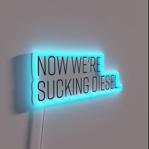 Neon warning sign with bold red and green 'Diesel' lettering