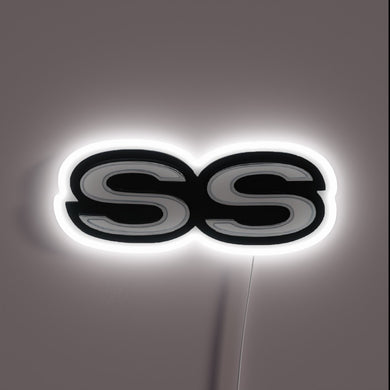 Vintage Chevrolet SS logo illuminated in bright RGB neon lights