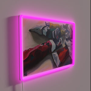 Colorful paint tubes illuminated in vibrant RGB neon glow effect.