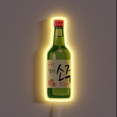 Peach soju bottle with yellow neon glow.
