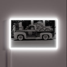 Load image into Gallery viewer, Vintage-style illuminated logo of Peerless Distillery&#39;s iconic truck emblem
