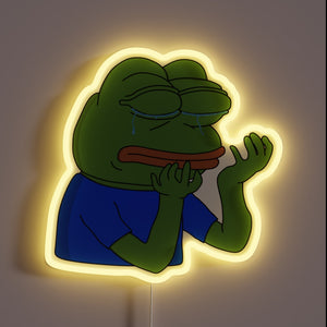 Sad frog, glowing bright — this neon sign screams *PepeHands* energy.