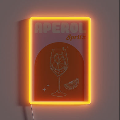 Vibrant pink glow of a signature Italian summer cocktail sign.