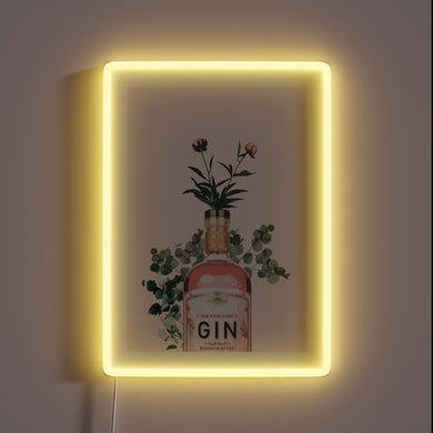 Vibrant pink neon sign illuminates space with gin-inspired artwork style