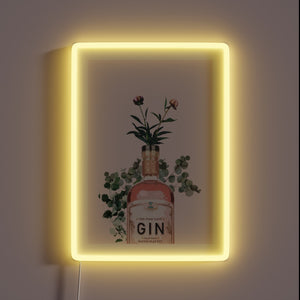 Vibrant pink neon sign illuminates space with gin-inspired artwork style