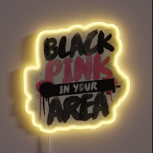 Load image into Gallery viewer, Neon sign with graffiti-style text: &quot;BLACKPINK IN YOUR AREA&quot; in bold black and pink letters.
