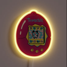 Load image into Gallery viewer, This glowing pink Tamagotchi neon sign brings nostalgic 90s vibes back to life—pixel pet and all!