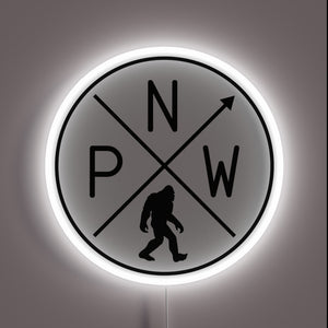 Vibrant Pacific Northwest Sasquatch illuminated in colorful LED neon lighting.