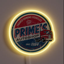 Load image into Gallery viewer, This neon sign brings a nostalgic twist with its **vintage garage** design, featuring &quot;Prime&#39;s Autoshop&quot; and a red semi-truck clearly inspired by *Optimus Prime*. Perfect for fans of classic trucks, 80s throwbacks, or Transformers lore.