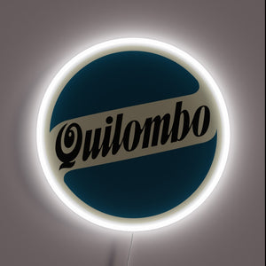 Vintage Quilombo Quilmes beer logo illuminated in radiant neon lights.