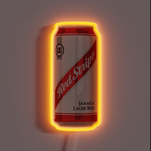 Load image into Gallery viewer, Neon sign shaped like a Red Stripe Jamaica Lager Beer can with orange glow.
