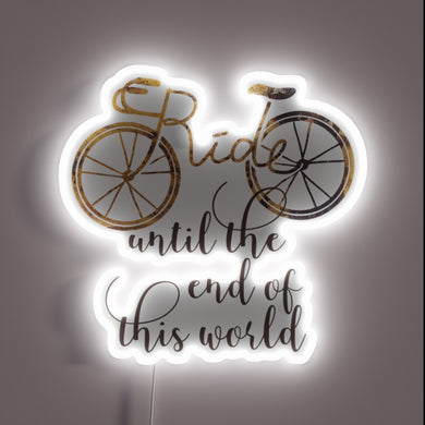 Neon light installation featuring 'Ride It Till The End' phrase.