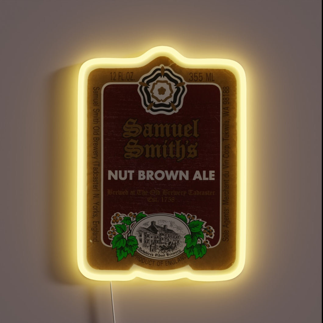 Classic beer branding on a vibrant, colorful, neon RGB sign.