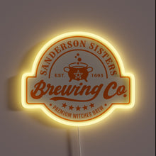 Load image into Gallery viewer, Thanks! This version of the **Sanderson Sisters Brewing Co.** sign has a warm orange glow and a different cauldron design featuring a pentagram, giving it a more mystical and witchy vibe. Perfect for Halloween decor or fans of *Hocus Pocus*!