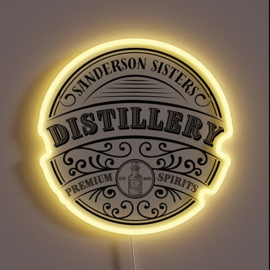 Vibrant RGB glow illuminates Sanderson Sisters Distillery logo with eerie charm.